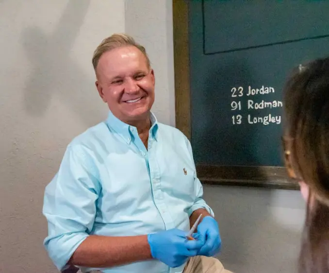 Dr Metcalf with a a patient